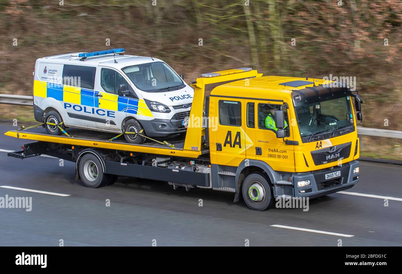 AA Recovery of Police commercial vans, police van dealer, Ford Transit 2.2 TDI vans,  collection and deliveries, auctions of ex-police cars; Vehicles being transported by vehicle carrier on the m6 Motorway, UK Stock Photo