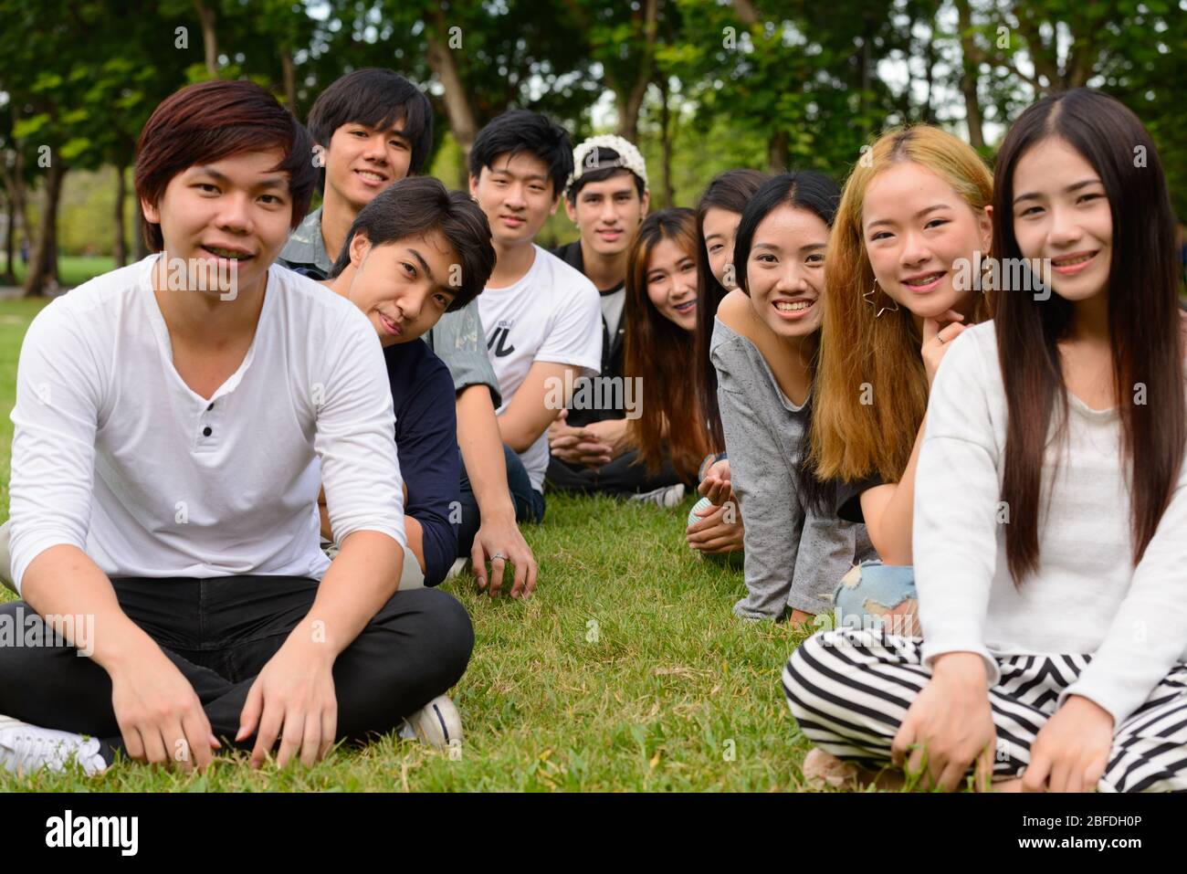 Happy young group of friends having fun together at the park Stock ...
