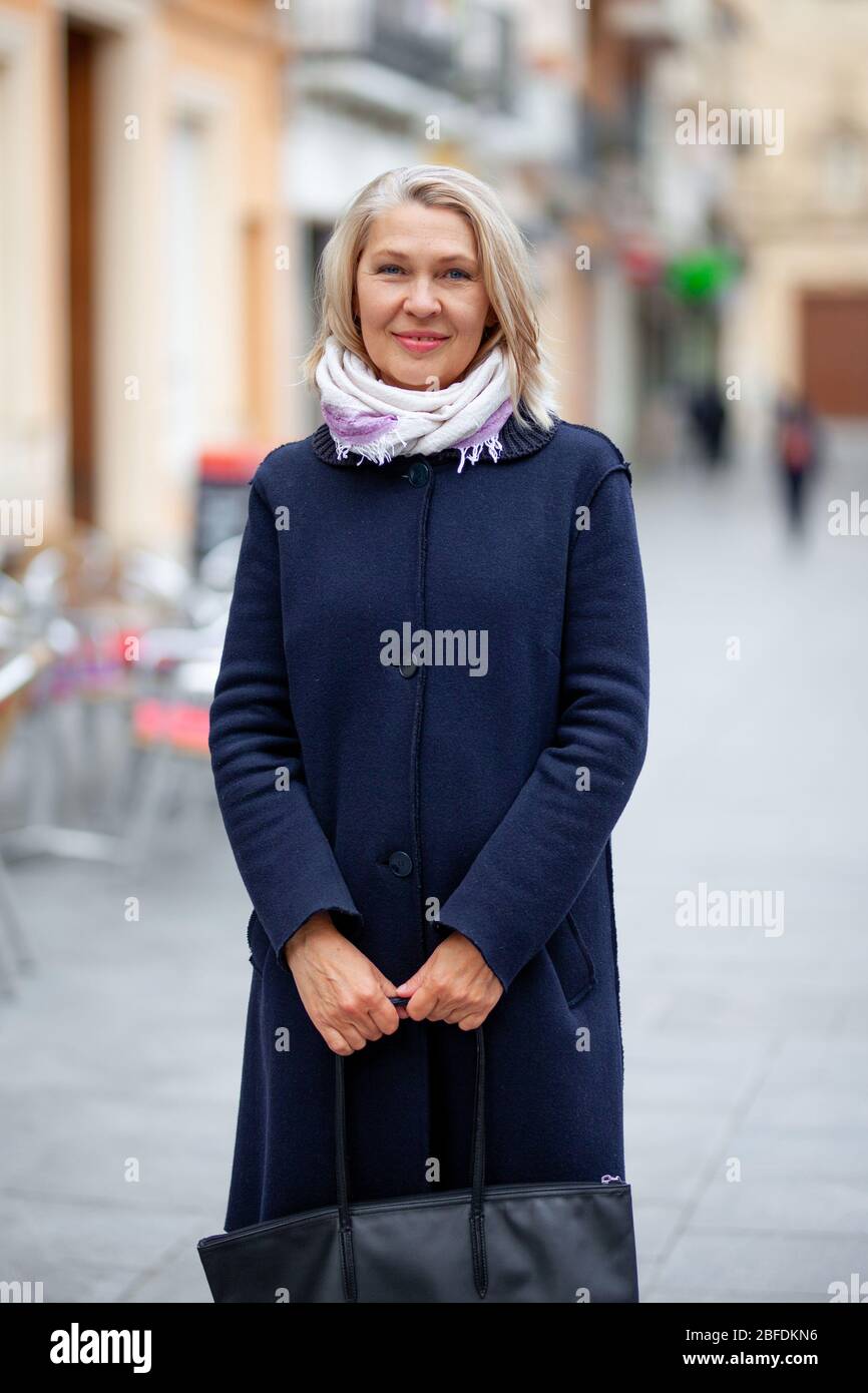 Attractive mature woman walks hi-res stock photography and images - Alamy