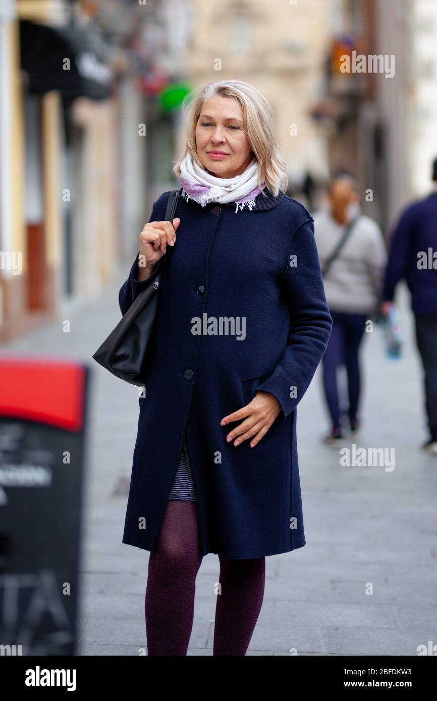Attractive mature woman walks hi-res stock photography and images - Alamy