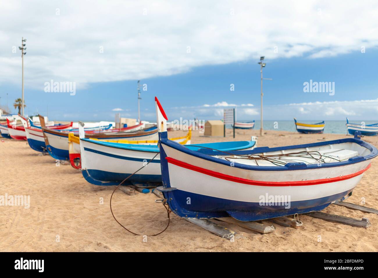 colorful fishing boats by the sea on a sunny day Stock Photo - Alamy