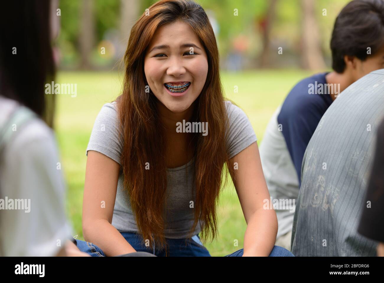 Happy young group of friends having fun together at the park Stock ...