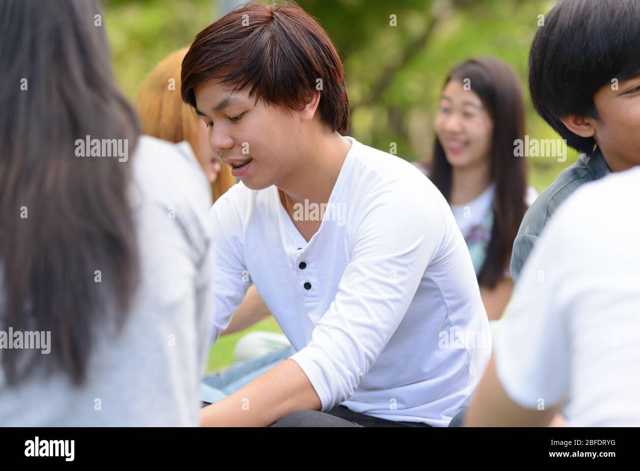Happy young group of friends having fun together at the park Stock ...