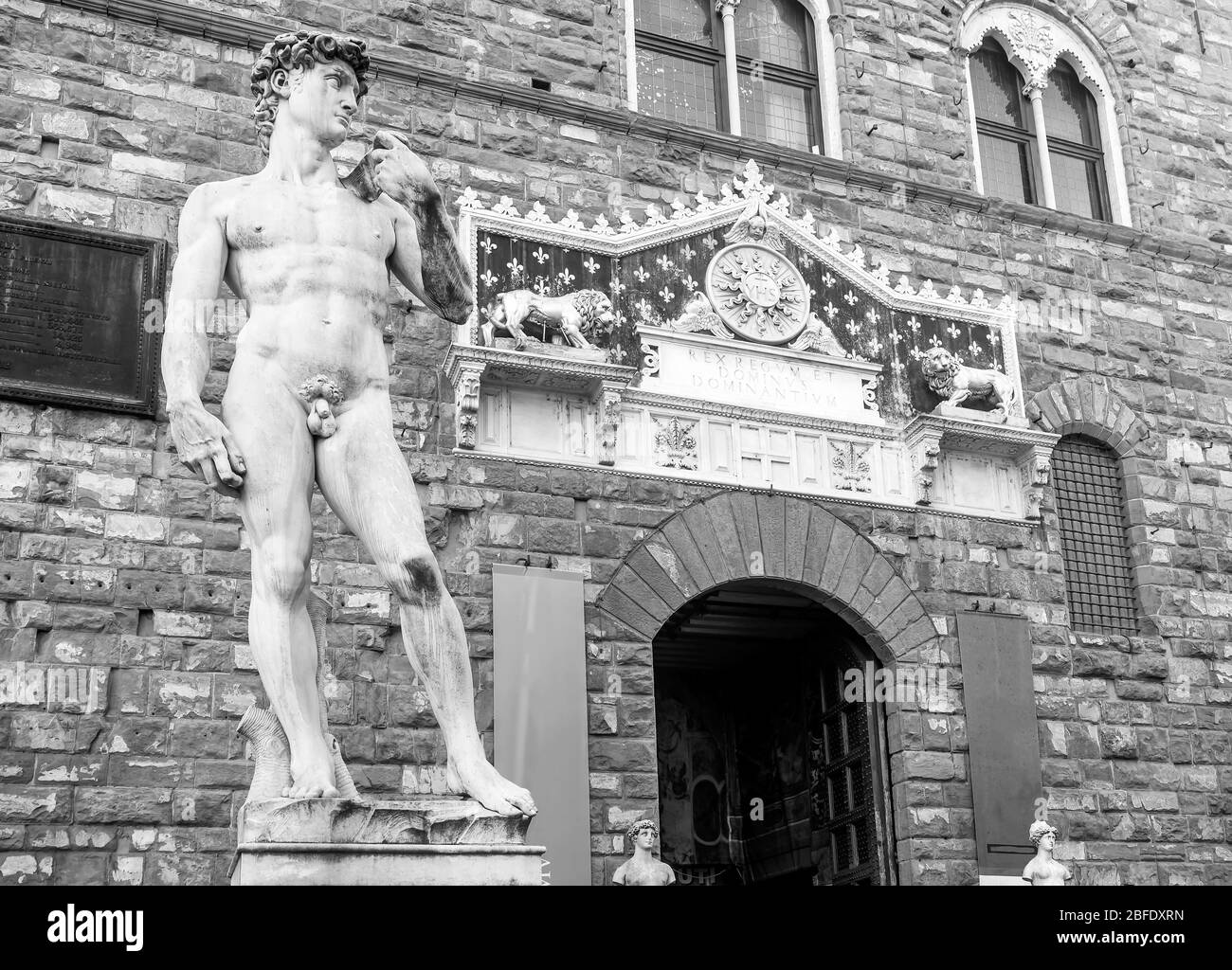 The replica of Michelangelo's David in Piazza della Signoria, historic center of Florence, Italy, in black and white Stock Photo