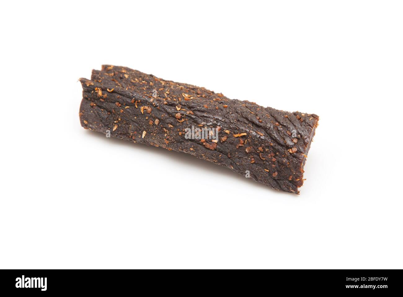 Beef Biltong, South African Beef Jerky isolated on a white studio background. Stock Photo