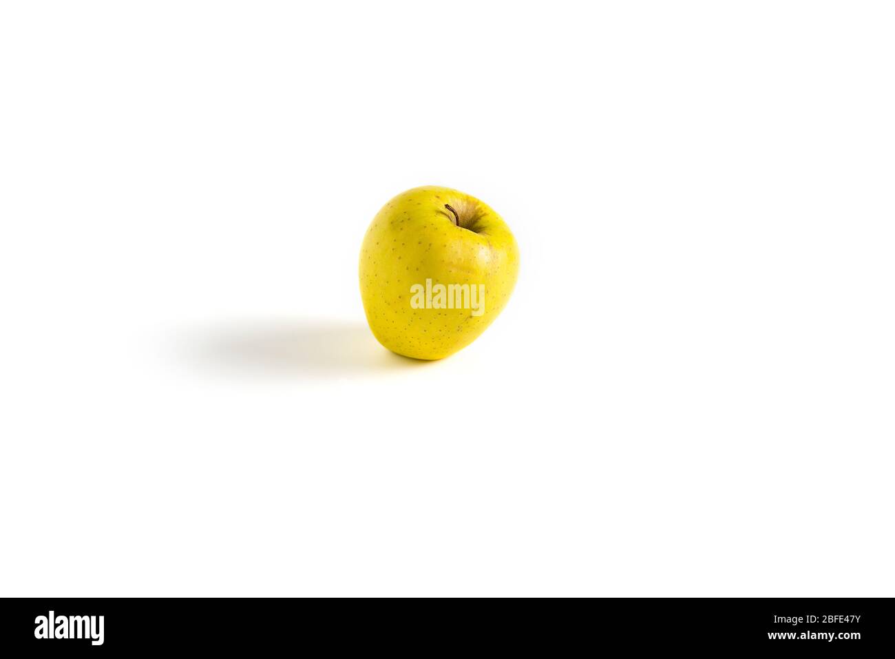 Isolated yellow apple on white background - horizontal image Stock Photo