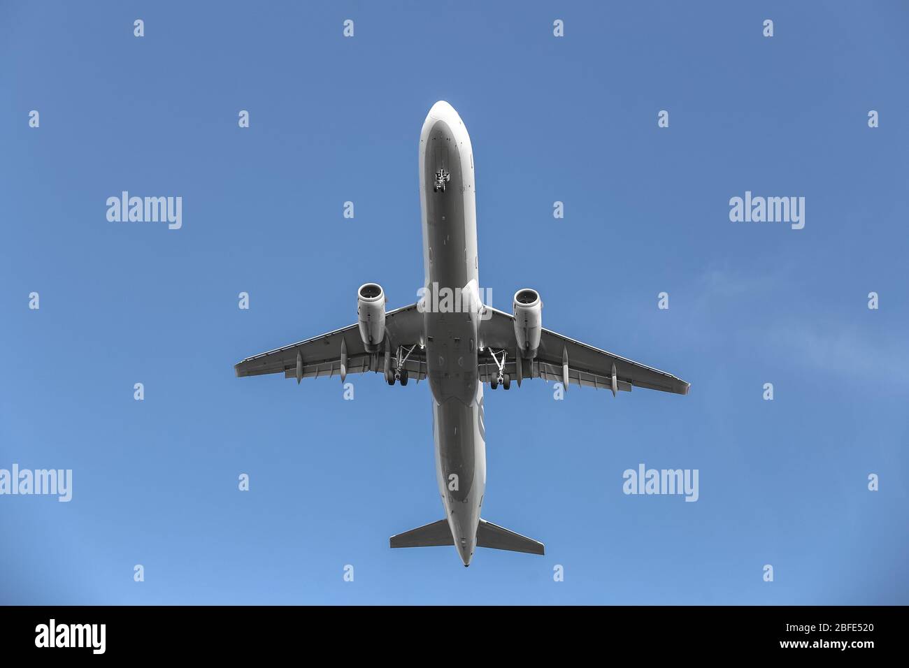 Passenger Airplane in the Sky with Blue Background Stock Photo - Alamy