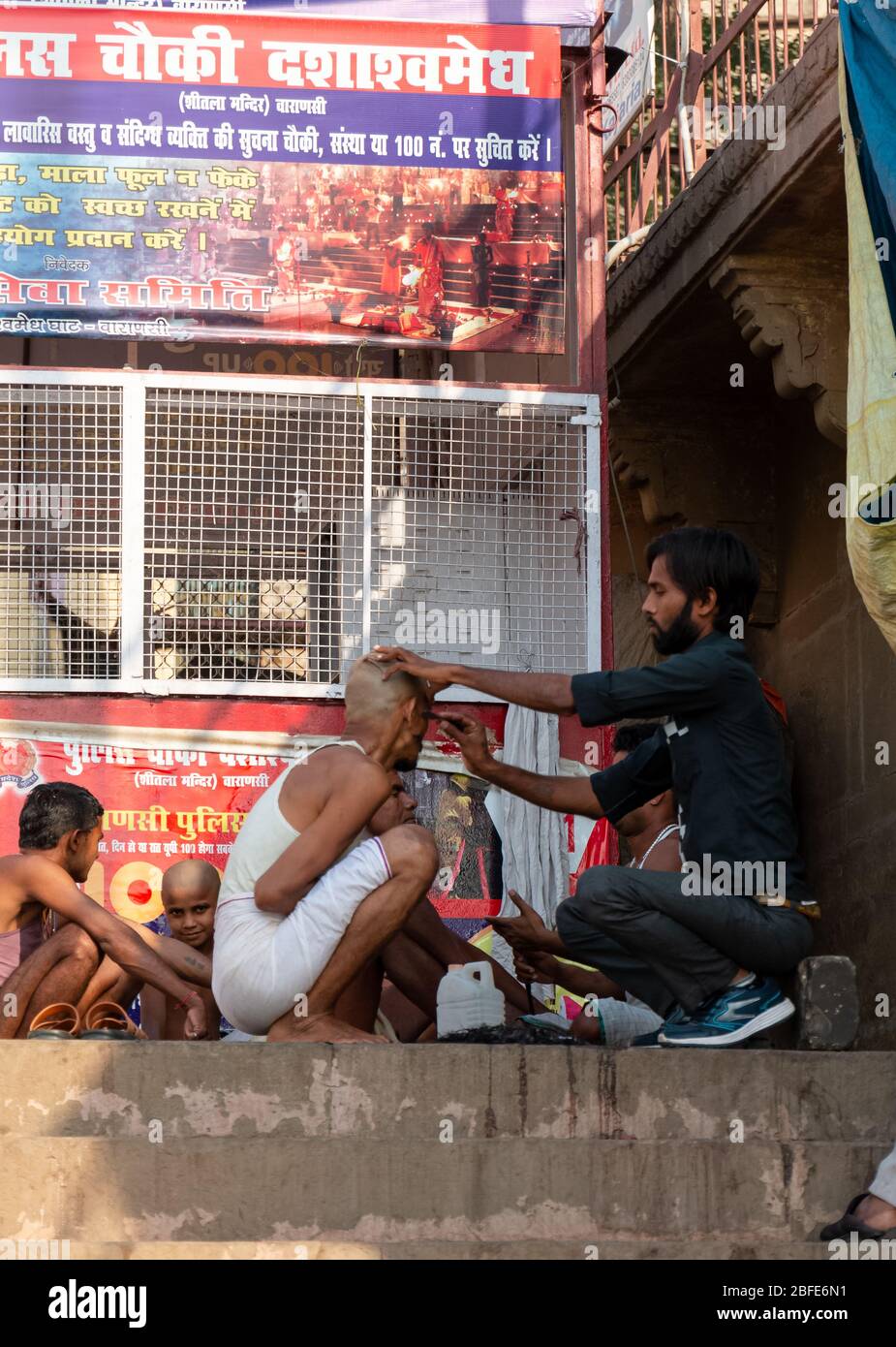 VARANASI, UTTAR PRADESH / INDIA - APRIL 2019 : Barber shop on the streets of Varanasi Ghats Stock Photo