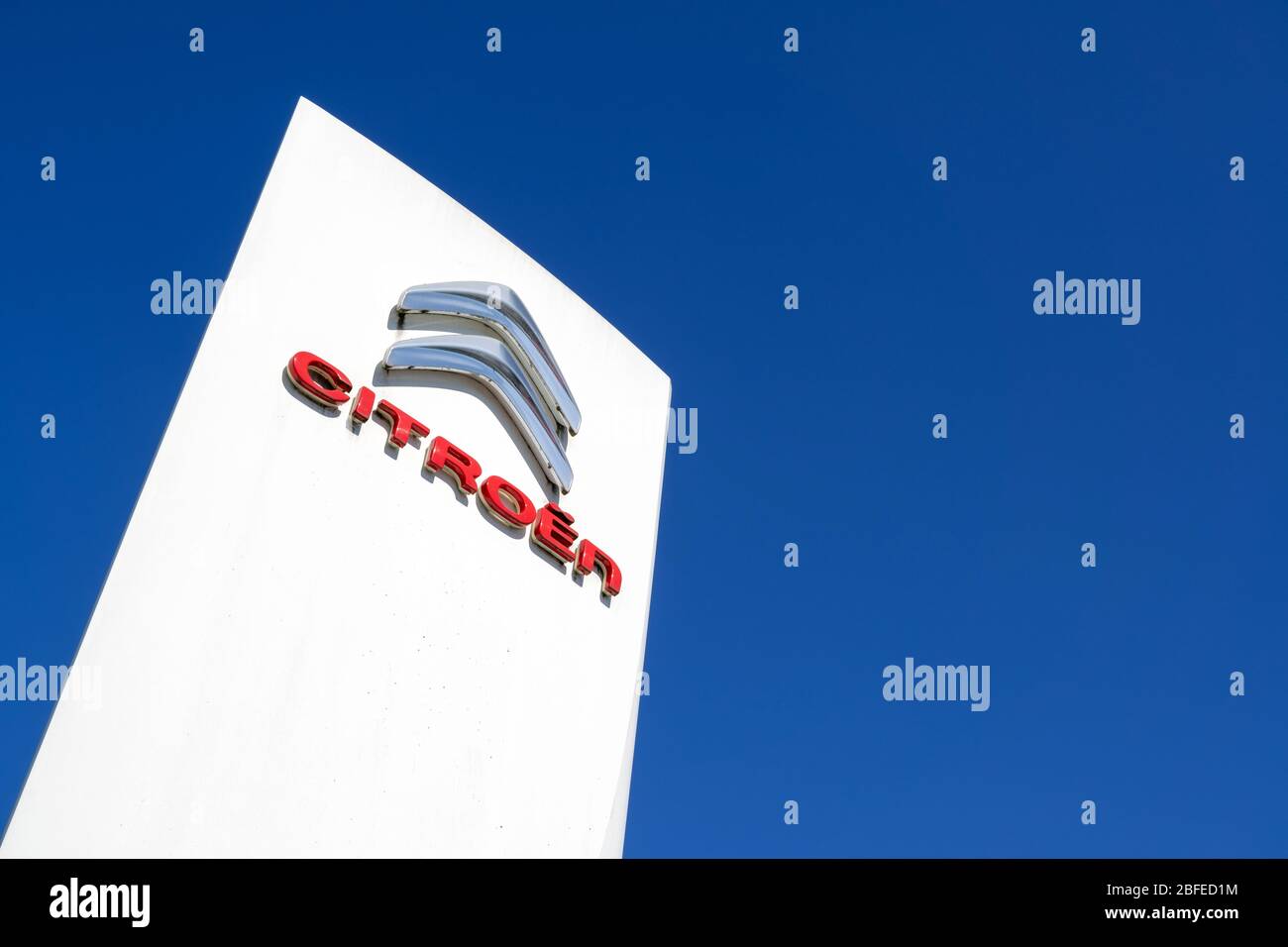 Citroen dealership sign against blue sky. Stock Photo