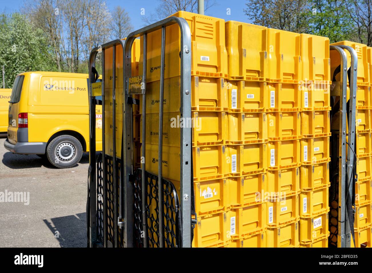 Transport boxes at Deutsche Post depot. Deutsche Post is a brand of Deutsche Post AG used for its domestic mail services in Germany. Stock Photo
