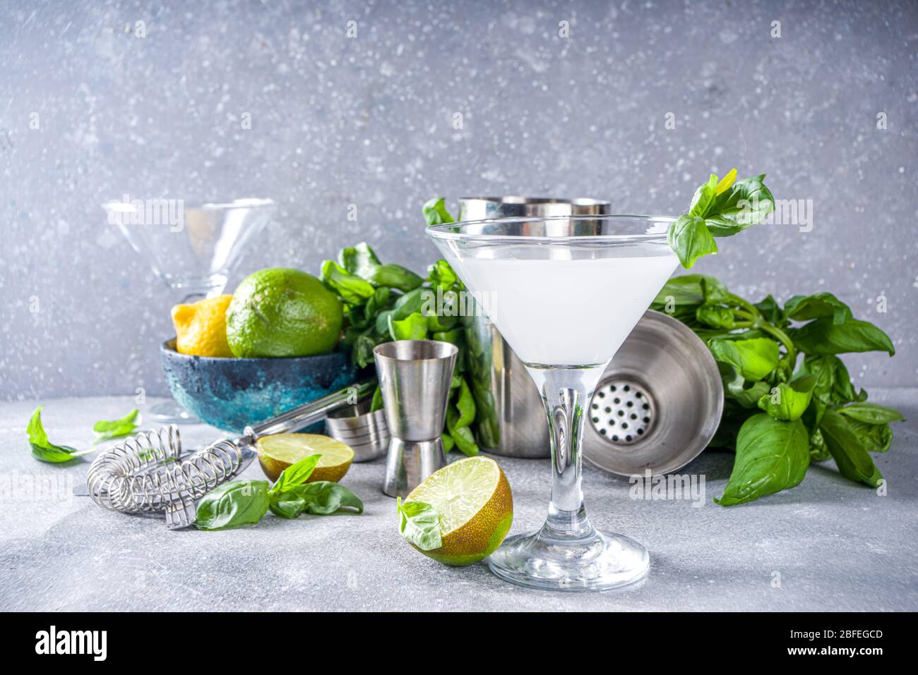 Basil vodka gimlet martini cocktail. Strong alcohol drink with fresh