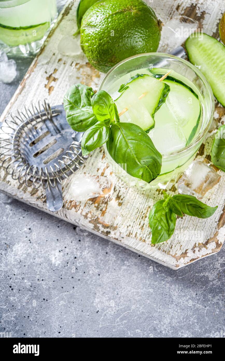 Cucumber basil smash gin and vodka alcohol cocktail. Infused summer