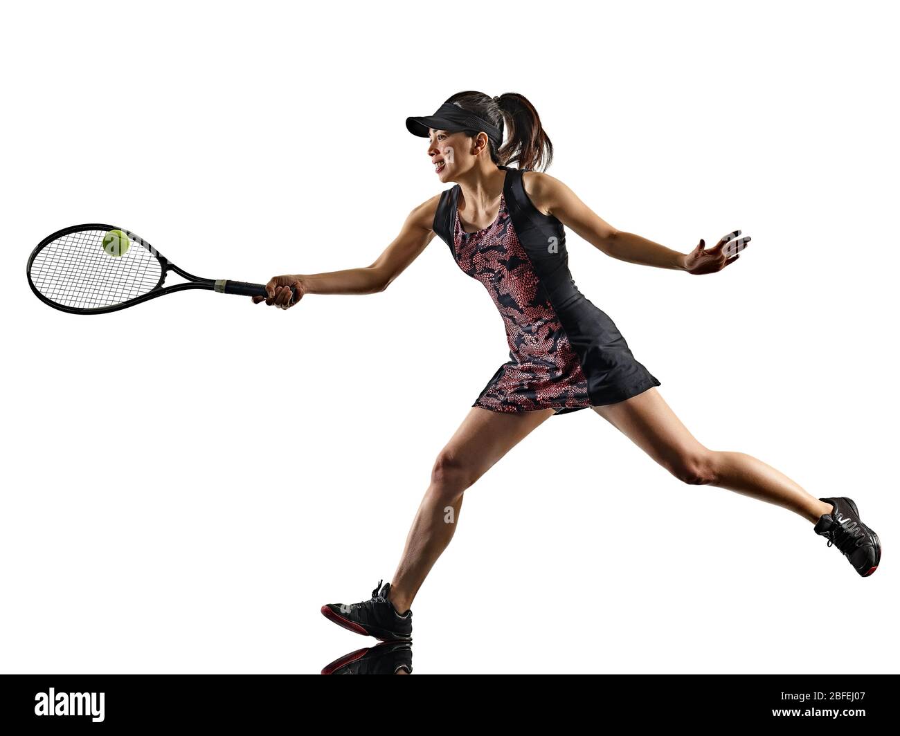 one young tennis player asian woman isolated in studio silhouette on white brackground Stock Photo