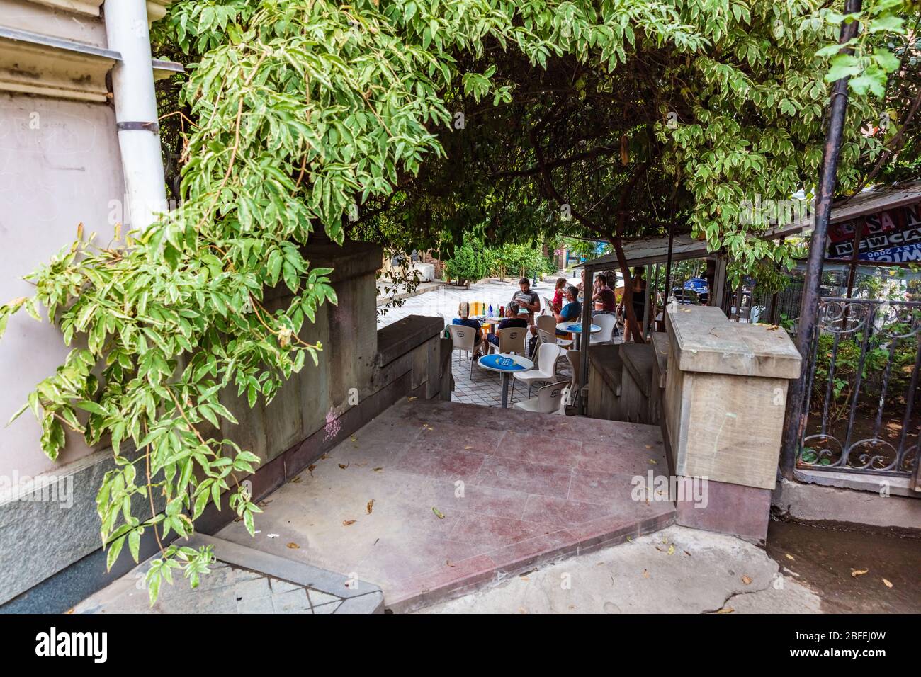 Tbilisi , Georgia - August 25, 2019 :  Tourist people enjoying restaurant in a street of the old town landmark of Tbilisi Georgia capital city eastern Europe Stock Photo