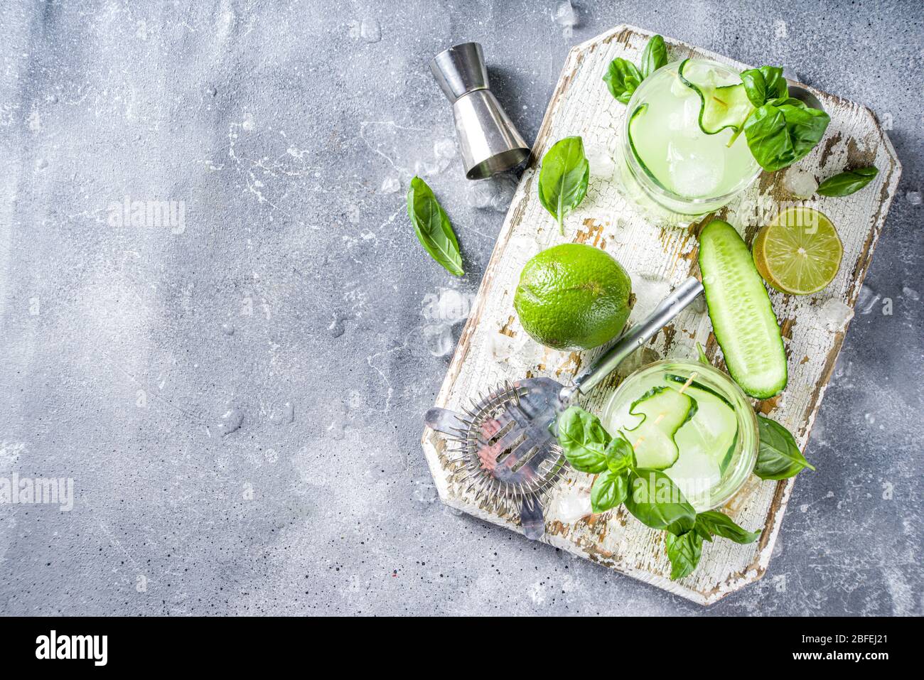 Cucumber basil smash gin and vodka alcohol cocktail. Infused summer
