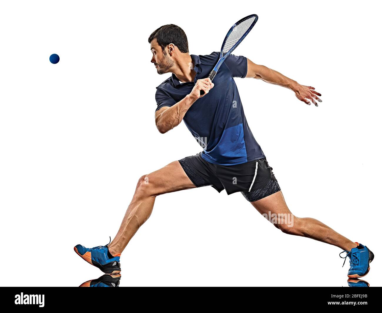 one caucasian mature man practicing squash player  in studio  isolated on white background Stock Photo