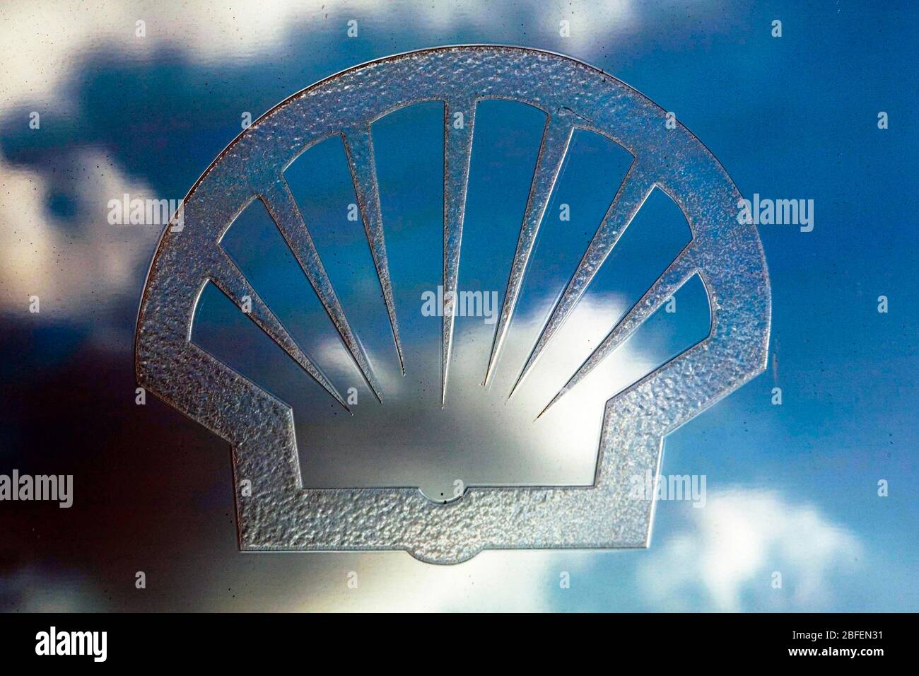 The Royal Dutch Shell logo reflecting the sky Stock Photo - Alamy