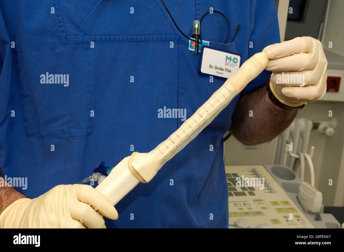 A doctor preparing an ultrasound probe for a biopsy of prostate Stock