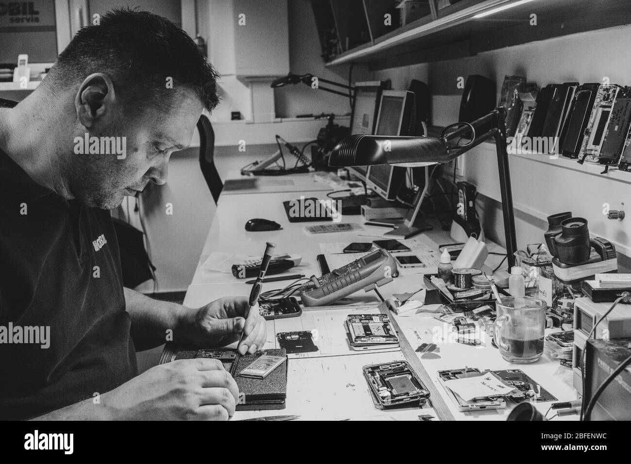 Mobile phones repairman Stock Photo Alamy