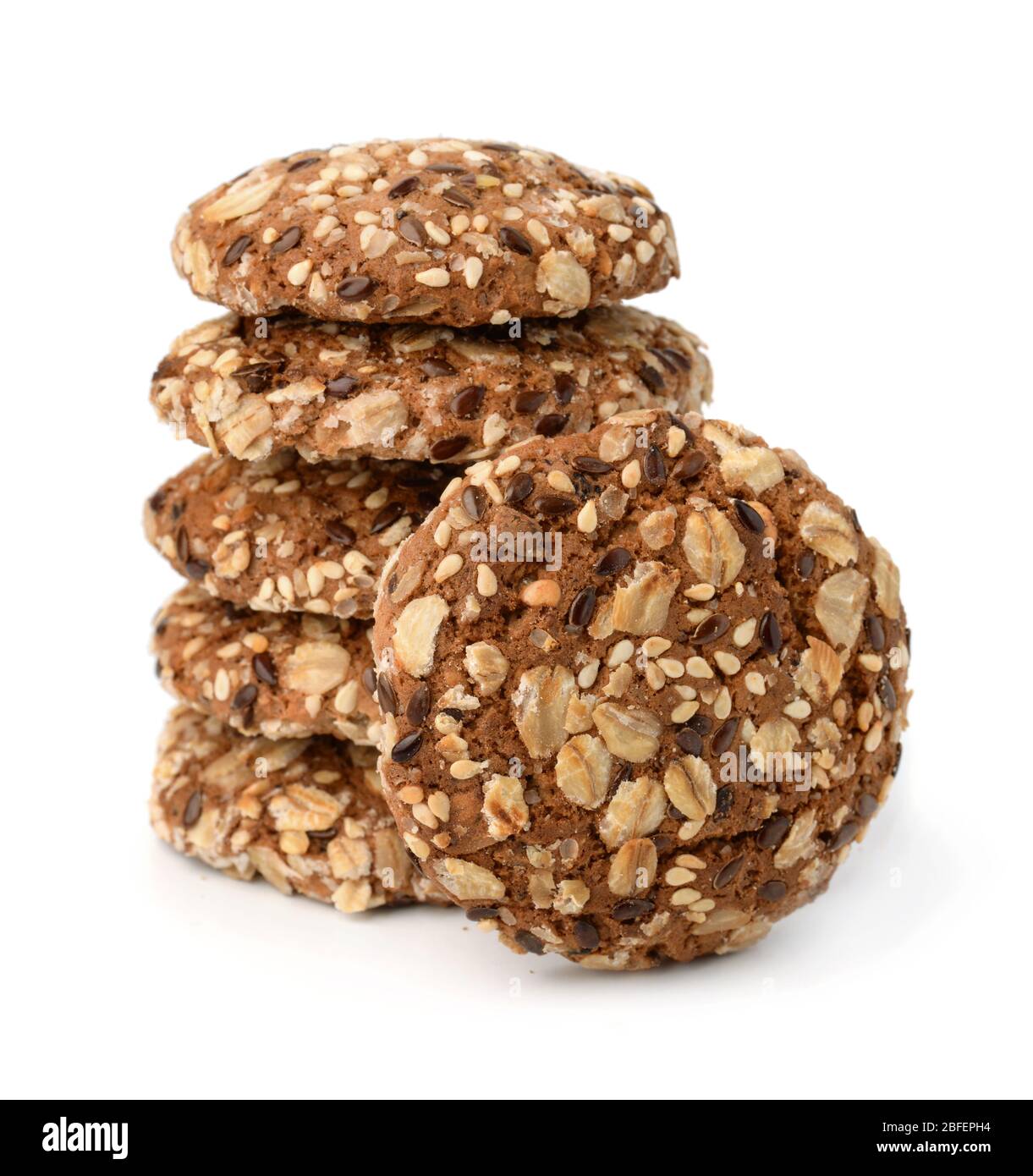 Stack of multigrain cookies with sesame and flaxseeds isolated on white Stock Photo