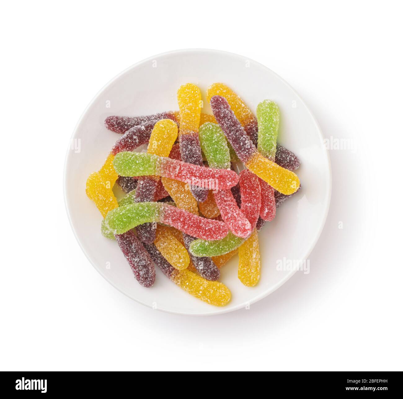 Plate of of colorful gummy jelly worm candies isolated on white Stock Photo
