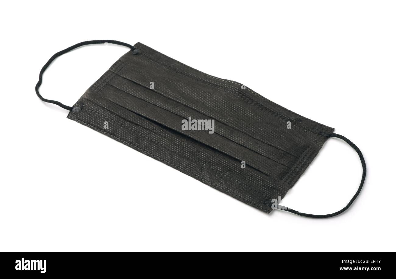 Black disposable medical face mask isolated on white Stock Photo - Alamy