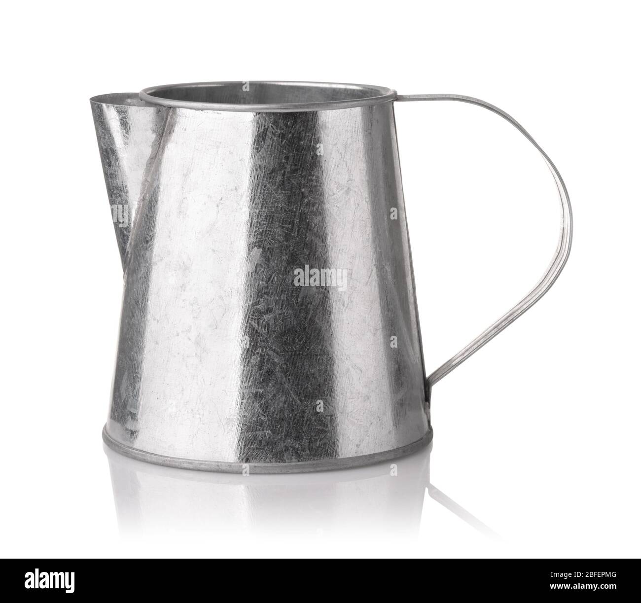 Side view of unpainted zinc plated tin jug isolated on white Stock Photo
