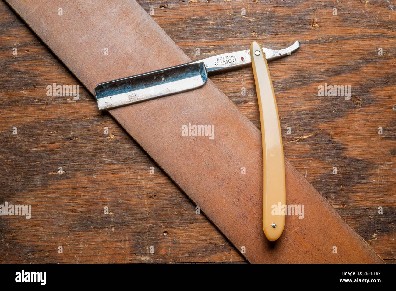 Premium Photo  Straight razor. vintage tools for barbers, razor, sharpen  the blade in leather brush, razor blades. man stropping straight razor with  leather tool.