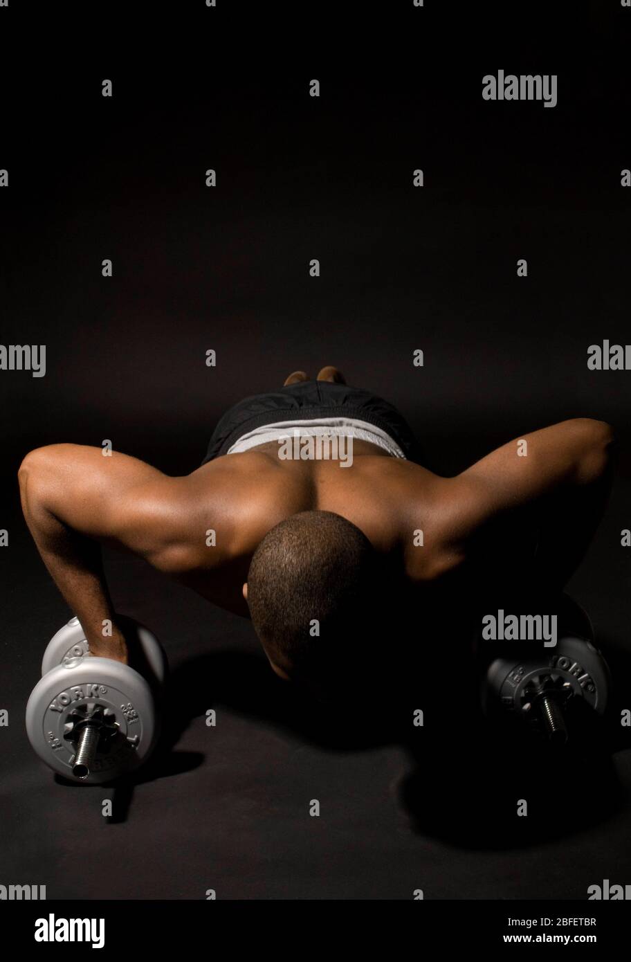 A man exercising by doing push-ups Stock Photo