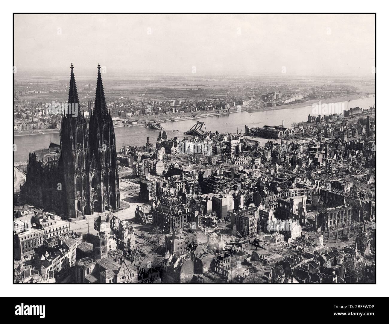 WW2 Cologne Cathedral 1945 intact standing after precision RAF Allied bomb aiming, amidst wide spread bomb bombing raid destruction caused by World War 2 allied 'reprisal' bombing air raids on 9th March 1945  Two months later with Hitler dead, Nazi Germany faced with total obliteration, unconditionally surrendered 8th May 1945 Second World War World War II COLOGNE Germany Stock Photo