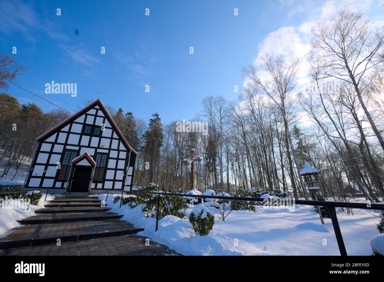 Lubno, Poland- 7 February 2012: small half -timbered church, parish of the king Christ, winter, black and white photography Stock Photo