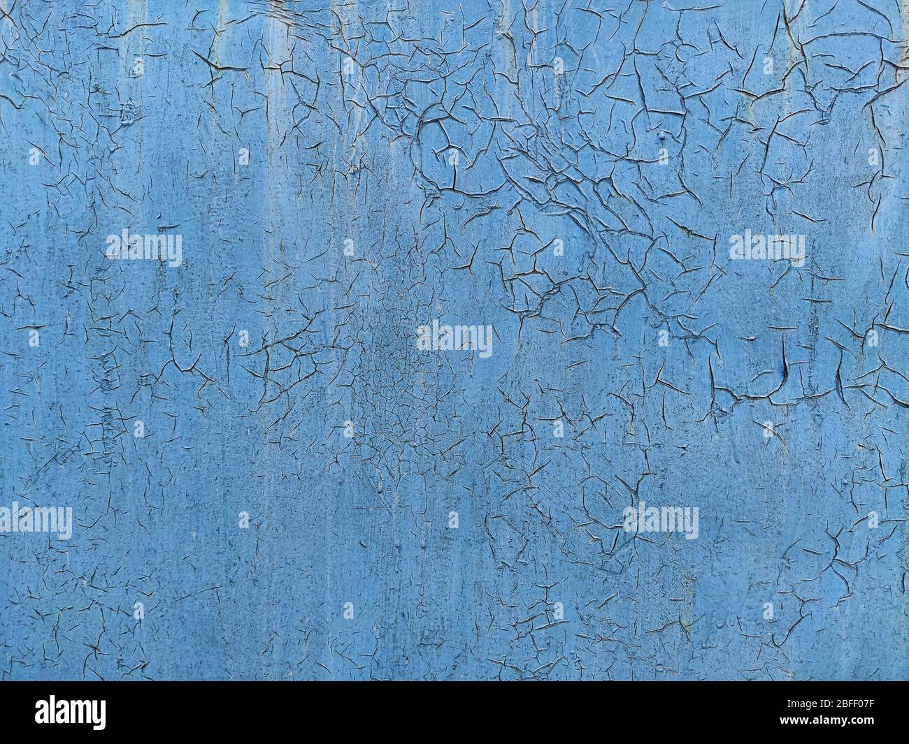 Corroded metal background. Rusted blue painted metal wall. Rusty metal background with streaks of rust. Rust stains. The metal surface rusted spots. R Stock Photo