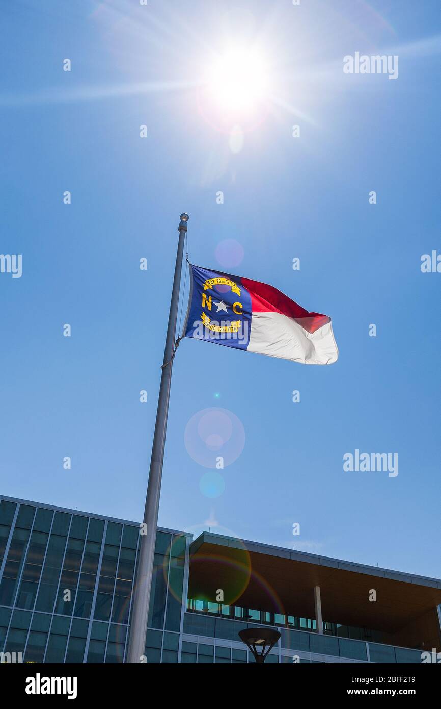 North Carolina State Flag against Blue Sky Stock Photo