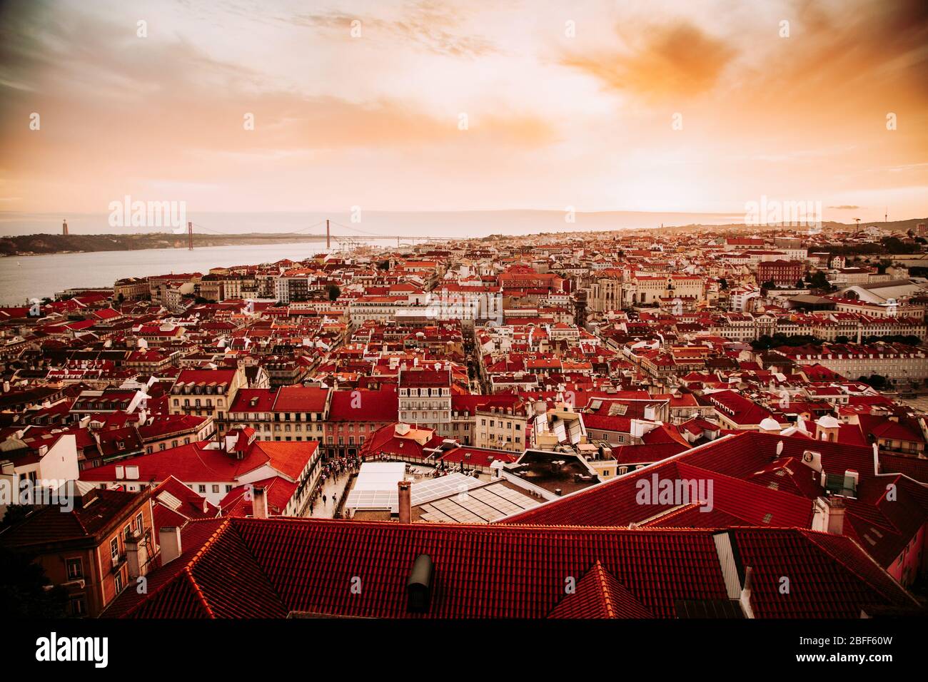 Beautiful panorama of old town and Baixa district in Lisbon city during sunset, seen from Sao Jorge Castle hill, Portugal Stock Photo