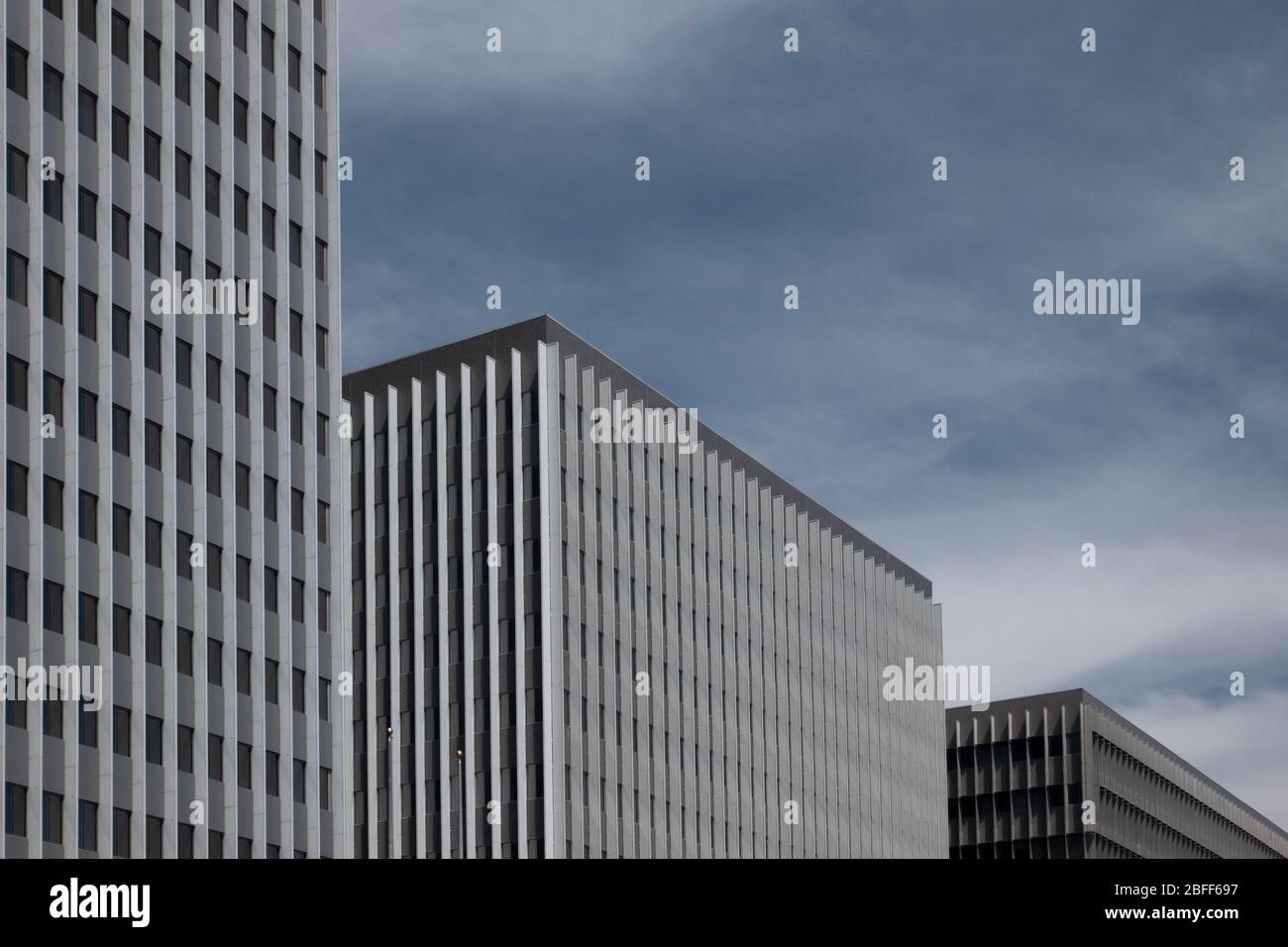 Drab gray flat anonymous architecture shots of blocky office retro brutalist 60s office towers in downtown Los Angeles Stock Photo