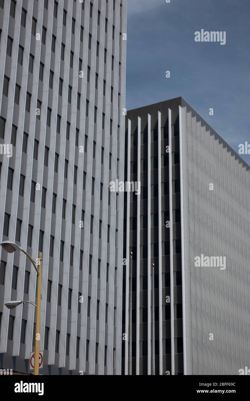 Drab gray flat anonymous architecture shots of blocky office retro brutalist 60s office towers in downtown Los Angeles Stock Photo
