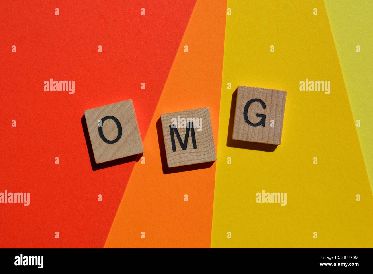 OMG, acronym for Oh My God isolated on brightly coloured background Stock Photo
