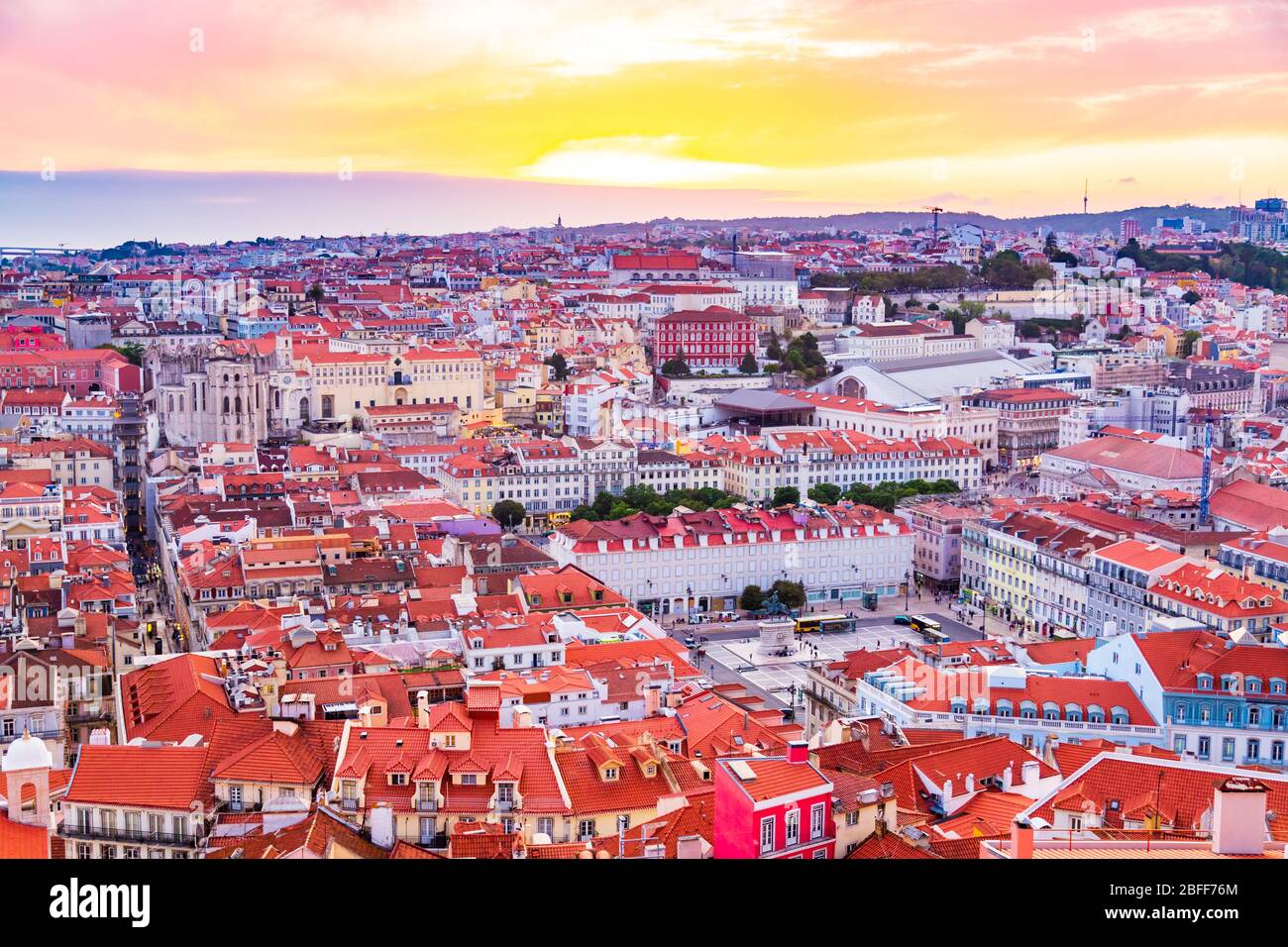 Beautiful panorama of old town and Baixa district in Lisbon city during sunset, seen from Sao Jorge Castle hill, Portugal Stock Photo