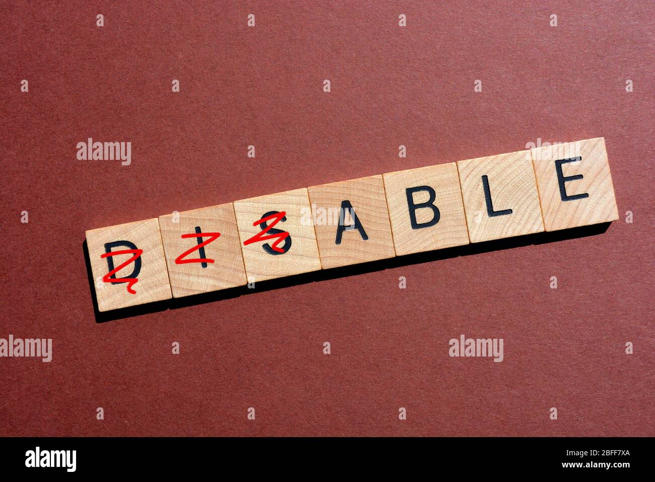 Disable, word with Dis crossed out leaving Able Stock Photo