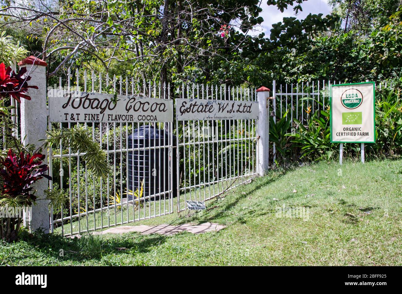 Roxborough, Trinidad and Tobago - January 10, 2020: Gates at the entrance to the Tobago Cocoa Estate which produces organic cocoa beans for the chocol Stock Photo