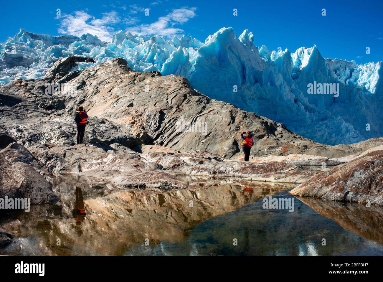 Tourists of Skorpios III cruise at El Brujo Glacier On The Edge Of The Sarmiento Channel in Bernardo O'Higgins National Park in Patagonia Chile fjords Stock Photo