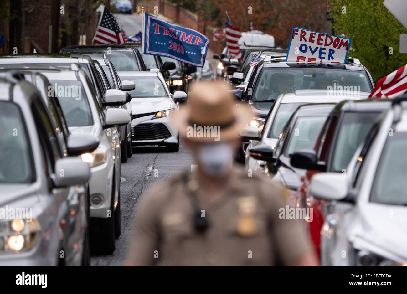 Annapolis, United States. 18th Apr, 2020. Drivers in vehicles participate in a car protest to reopen Maryland and end the stay at home order imposed during the Coronavirus COVID-19 pandemic, near the state capitol building in Annapolis, Maryland on Saturday, April 18, 2020. Drivers circled Annapolis hoking their horns and calling for Gov. Larry Hogan (R-MD) to end the stay at home order. Photo by Kevin Dietsch/UPI Credit: UPI/Alamy Live News Stock Photo