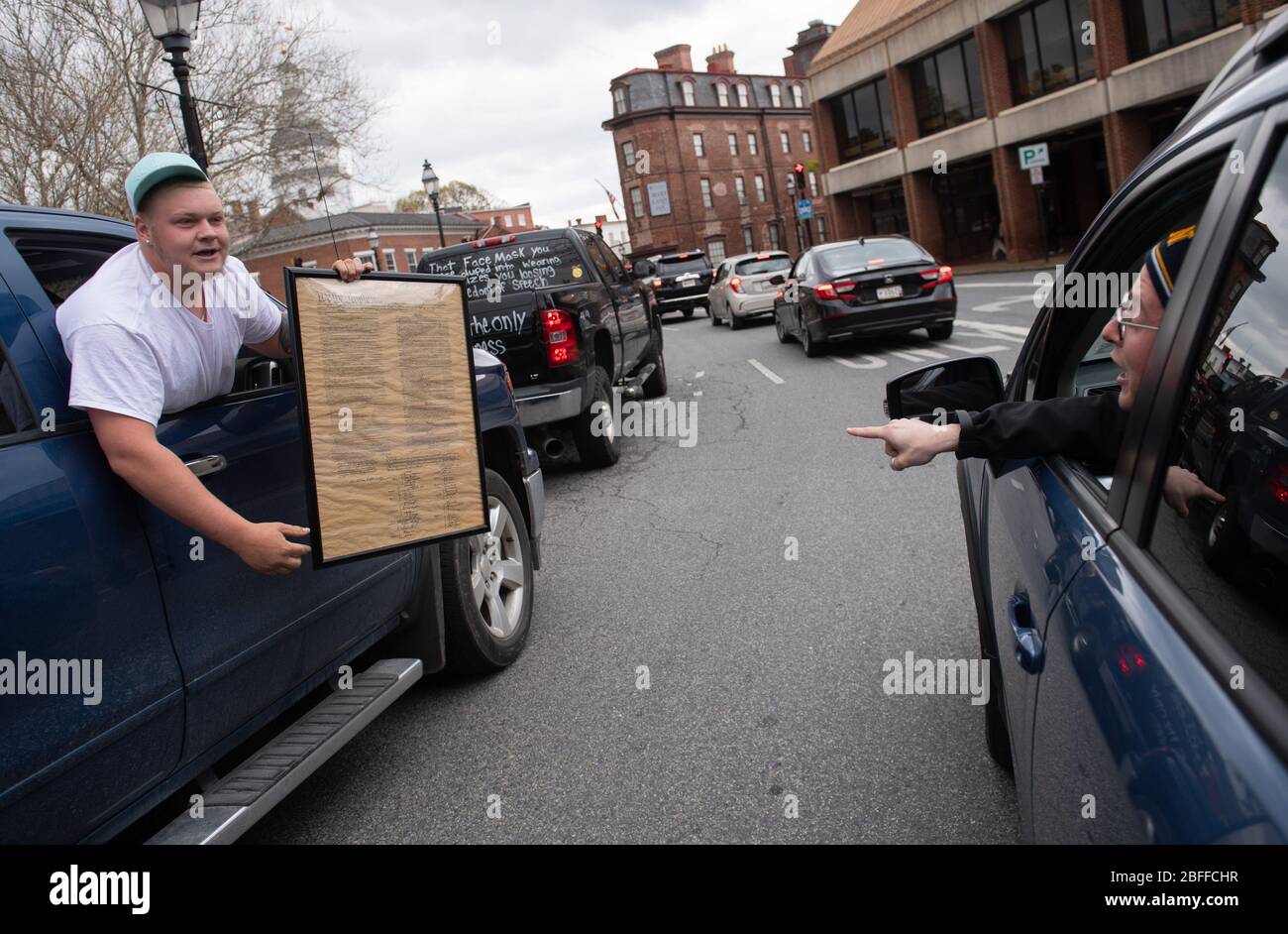 Annapolis, United States. 18th Apr, 2020. A protester and counter protester argue during a car protest to reopen Maryland and end the stay at home order imposed during the Coronavirus COVID-19 pandemic, near the state capitol building in Annapolis, Maryland on Saturday, April 18, 2020. Drivers circled Annapolis hoking their horns and calling for Gov. Larry Hogan (R-MD) to end the stay at home order. Photo by Kevin Dietsch/UPI Credit: UPI/Alamy Live News Stock Photo