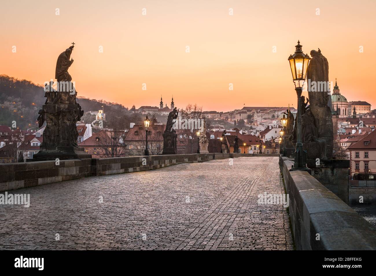 Statues on the empty Charles Bridge during sunset, Prague Stock Photo