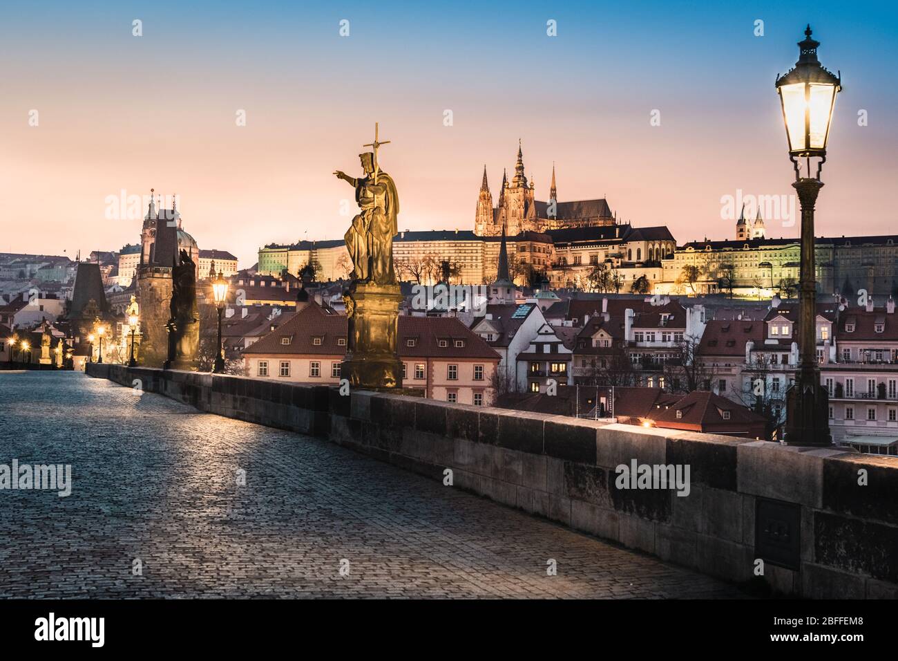 Charles bridge during sunset - empty due to coronavirus pandemic, Prague, Czech Republic Stock Photo