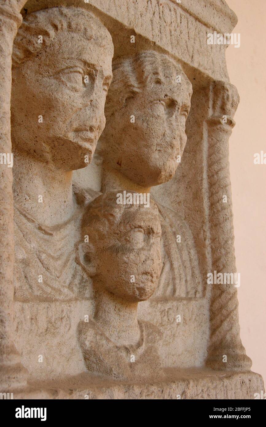 Roman stele. 1st CE.  Bust of Publio Arrio Montano, Mocazia Helpide (wife) Pubio Arrio Polluce son with "bulla"). Ravenna. Itay. Stock Photo