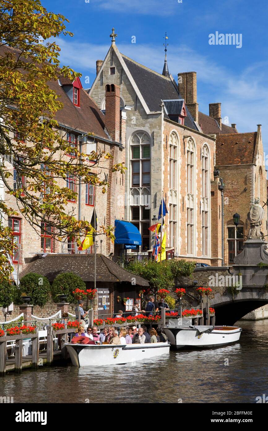 Tour boat on the canal in Bruges,West Flanders,Belgium,Europe Stock Photo