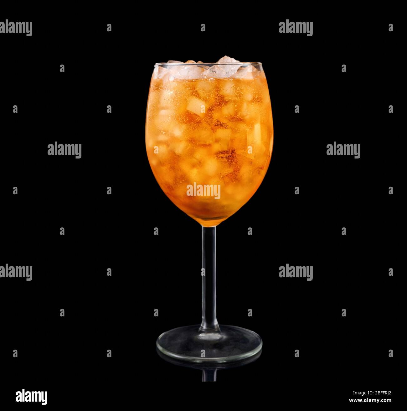 Glass of aperol spritz cocktail isolated on black background Stock Photo