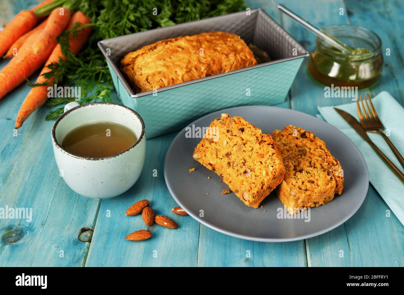 Delicious vegan carrot cake on turquoise blue background Stock Photo