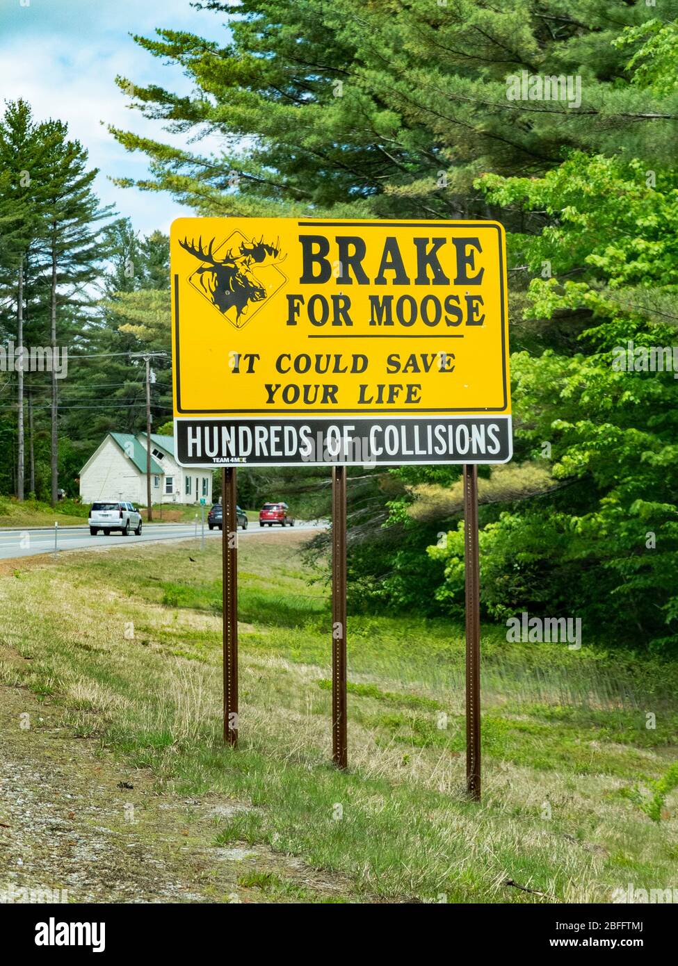 A sign in Whitefield, New Hampshire warns motorists to brake for moose which are commonly found crossing local roads. Stock Photo